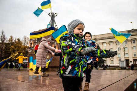 kid of Kherson celebrate the liberation of the city on Freedom Square in the city center. Russian troops left Kherson after a nine-month occupationのeditorial素材