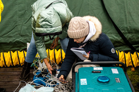 Residents of Kherson in Ukraine can now charge their mobile phones. The municipality has installed an antenna to receive and make telephone calls after the Russian army bombed the city's infrastructure.のeditorial素材