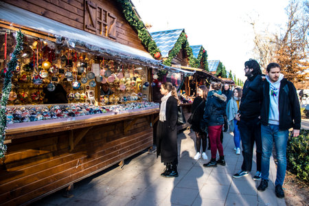 People visiting the Christmas Market in Reims will take place from December 1 to 30, 2022. On the Promenades Jean-Louis Schneiter, the 150 chalets of the "Christmas Village" will be deployed. The stands are made up of a multitude of gastronomic, artisanalのeditorial素材