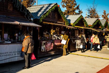 People visiting the Christmas Market in Reims will take place from December 1 to 30, 2022. On the Promenades Jean-Louis Schneiter, the 150 chalets of the "Christmas Village" will be deployed. The stands are made up of a multitude of gastronomic, artisanalのeditorial素材