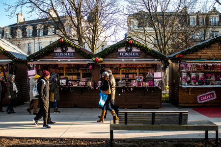 People visiting the Christmas Market in Reims will take place from December 1 to 30, 2022. On the Promenades Jean-Louis Schneiter, the 150 chalets of the "Christmas Village" will be deployed. The stands are made up of a multitude of gastronomic, artisanalのeditorial素材