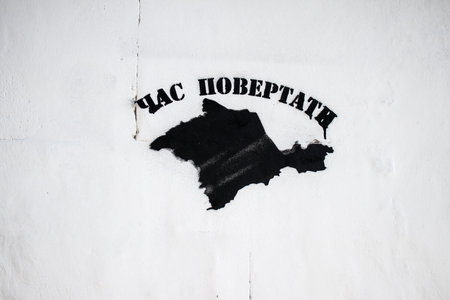Anti russian ukrainian nationalist graffiti painted by partisans during the Russian occupation on the walls and monuments of the city of Kherson. Russian troops left Kherson after a nine-month occupation.のeditorial素材