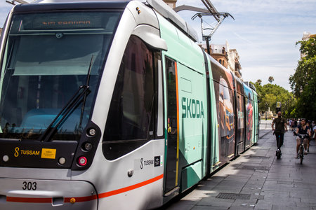 Sevilla, Spain - June 06, 2023 2023 Electric tram driving in the streets of Sevilla and part of the transport system of the city, the fares are not expensive.のeditorial素材