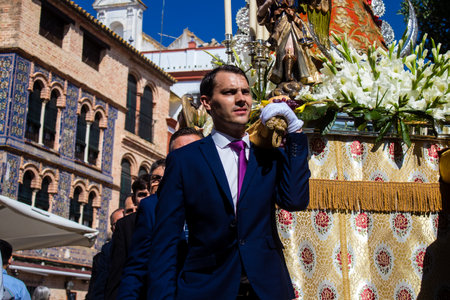 Honorary citizen participating in the Corpus Christi procession, their mission is to carry the religious statues. This age-old tradition of the Catholic faith to process the real presence of Jesus. Eucharistic processions take place in the narrow streets のeditorial素材