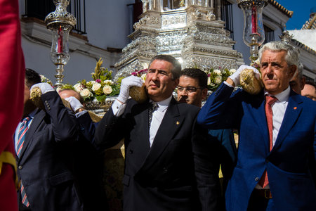 Honorary citizen participating in the Corpus Christi procession, their mission is to carry the religious statues. This age-old tradition of the Catholic faith to process the real presence of Jesus. Eucharistic processions take place in the narrow streets のeditorial素材