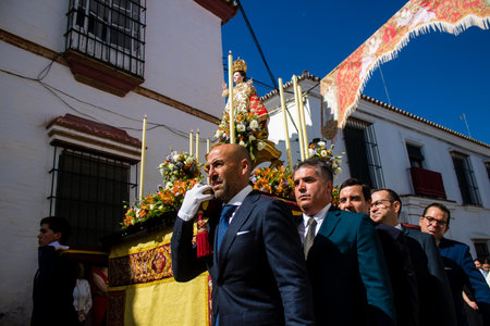Honorary citizen participating in the Corpus Christi procession, their mission is to carry the religious statues. This age-old tradition of the Catholic faith to process the real presence of Jesus. Eucharistic processions take place in the narrow streets のeditorial素材