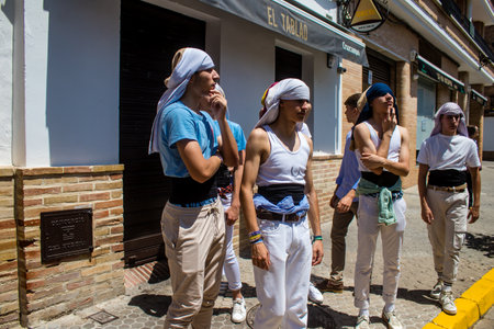 Honorary citizen participating in the Corpus Christi procession, their mission is to carry the religious statues. This age-old tradition of the Catholic faith to process the real presence of Jesus. Eucharistic processions take place in the narrow streets のeditorial素材