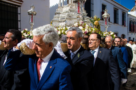 Honorary citizen participating in the Corpus Christi procession, their mission is to carry the religious statues. This age-old tradition of the Catholic faith to process the real presence of Jesus. Eucharistic processions take place in the narrow streets のeditorial素材