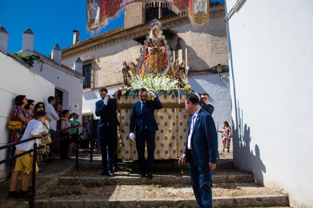 Honorary citizen participating in the Corpus Christi procession, their mission is to carry the religious statues. This age-old tradition of the Catholic faith to process the real presence of Jesus. Eucharistic processions take place in the narrow streets のeditorial素材