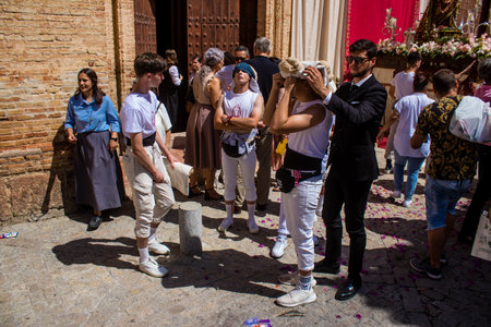 Honorary citizen participating in the Corpus Christi procession, their mission is to carry the religious statues. This age-old tradition of the Catholic faith to process the real presence of Jesus. Eucharistic processions take place in the narrow streets のeditorial素材