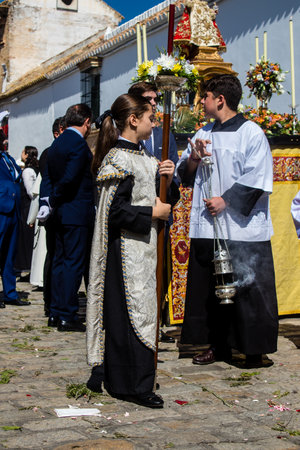 Catholic parish child participating in the Corpus Christi procession, an age-old tradition of the Catholic faith to process the real presence of Jesus. Eucharistic processions take place in the narrow streets of the old town of Carmona which is reputed toのeditorial素材