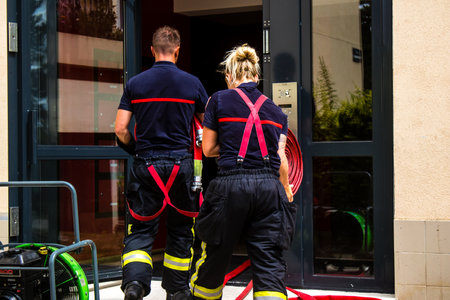 Firefighters are working to put out a fire that broke out in one of the buildings in the Croix Rouge...