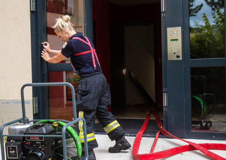 Firefighters are working to put out a fire that broke out in one of the buildings in the Croix Rouge district of Reims in France. Firefighters acted quickly and the fire was contained.のeditorial素材