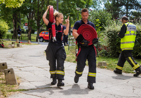 Firefighters are working to put out a fire that broke out in one of the buildings in the Croix Rouge district of Reims in France. Firefighters acted quickly and the fire was contained.のeditorial素材
