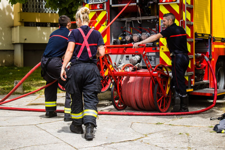 Firefighters are working to put out a fire that broke out in one of the buildings in the Croix Rouge...