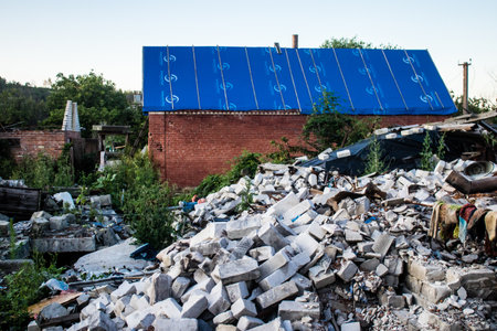 Damaged building located in the town of Kam'yanka. Civilian infrastructures are the privileged target of the Russian army. Russia invaded Ukraine and heavy fighting took place in this area.のeditorial素材