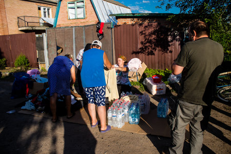 The few civilians residing in the village of Kam'yanka in Ukraine receive aid from humanitarian organizations. People live without water and electricity. The Russian army was driven out by the Ukrainians after several months of occupation.のeditorial素材