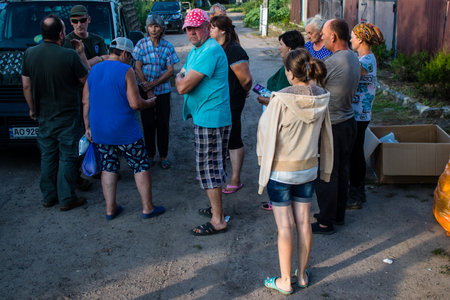The few civilians residing in the village of Kam'yanka in Ukraine receive aid from humanitarian organizations. People live without water and electricity. The Russian army was driven out by the Ukrainians after several months of occupation.のeditorial素材