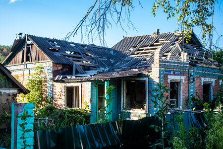 Damaged building located in the town of Kam'yanka. Civilian infrastructures are the privileged target of the Russian army. Russia invaded Ukraine and heavy fighting took place in this area.のeditorial素材