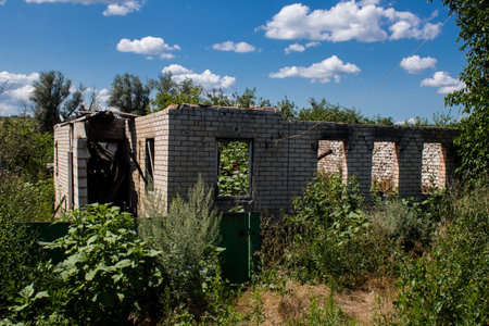 Damaged building located in the town of Kam'yanka. Civilian infrastructures are the privileged target of the Russian army. Russia invaded Ukraine and heavy fighting took place in this area.のeditorial素材