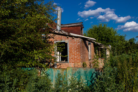 Damaged building located in the town of Kam'yanka. Civilian infrastructures are the privileged target of the Russian army. Russia invaded Ukraine and heavy fighting took place in this area.のeditorial素材