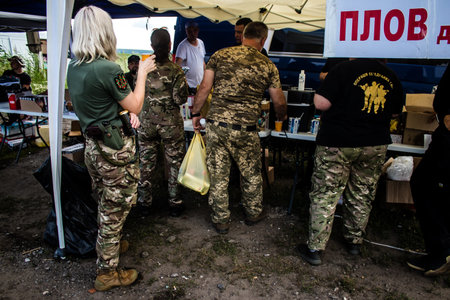 The volunteers of this humanitarian association offer free meals and food to the soldiers of the...