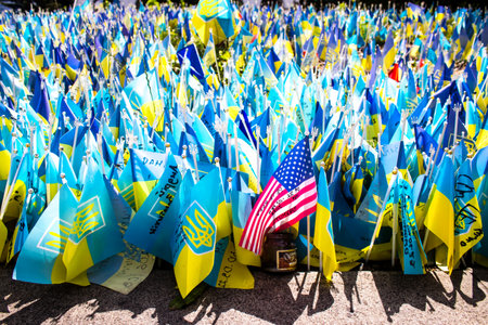 Thousands of flags have been planted at the makeshift memorial for fallen soldiers in Maidan Square in Kyiv. Each flag is a tribute to someone who was killed by Russia's war in Ukraine. The flags of different countries whose fighters are nationals are repのeditorial素材