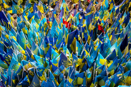 Thousands of flags have been planted at the makeshift memorial for fallen soldiers in Maidan Square in Kyiv. Each flag is a tribute to someone who was killed by Russia's war in Ukraine. The flags of different countries whose fighters are nationals are repのeditorial素材