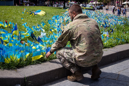 Thousands of flags have been planted at the makeshift memorial for fallen soldiers in Maidan Square in Kyiv. Each flag is a tribute to someone who was killed by Russia's war in Ukraine. The flags of different countries whose fighters are nationals are repのeditorial素材