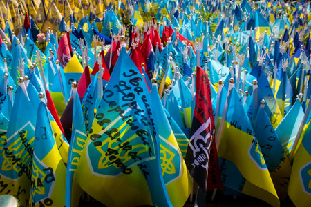 Thousands of flags have been planted at the makeshift memorial for fallen soldiers in Maidan Square in Kyiv. Each flag is a tribute to someone who was killed by Russia's war in Ukraine. The flags of different countries whose fighters are nationals are repのeditorial素材