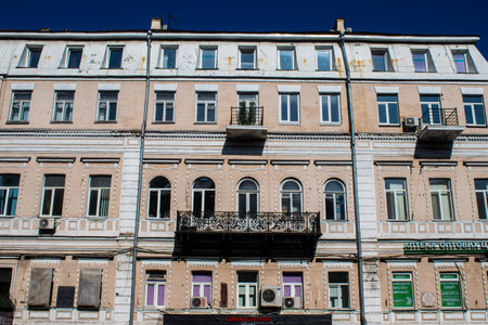 Facade of a building and architecture of the city of Kyiv, the capital of Ukraine during the war with Russia, the historical and modern buildings of Kyiv are the target of Russian missiles or drones. Thanks to a high-performance air defense system provideのeditorial素材
