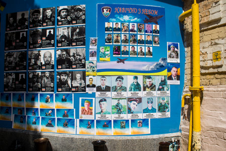 The wall, created in 2014, has been updated over the past decade to honor victims of Ukraine's wars against Russia. While the original panels were neatly structured with orderly military pictures, that changed after the beginning of the Russian invasion iのeditorial素材
