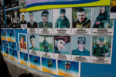 The wall, created in 2014, has been updated over the past decade to honor victims of Ukraine's wars against Russia. While the original panels were neatly structured with orderly military pictures, that changed after the beginning of the Russian invasion iのeditorial素材