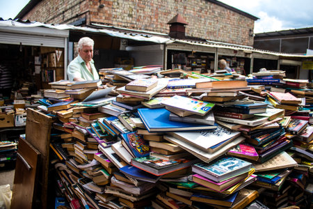 People shopping at book market Petrivka located in Kyiv, Ukraine. Famous for its great range of books. Sprawling open air market with stalls selling secondhand books. Despite the war and the fact that there are no tourists, this place remains very popularのeditorial素材