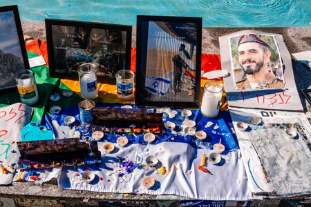 Tel Aviv, Israel - December 15, 2023. Dizengoff Square Memorial, Gifts and posters of the faces of...