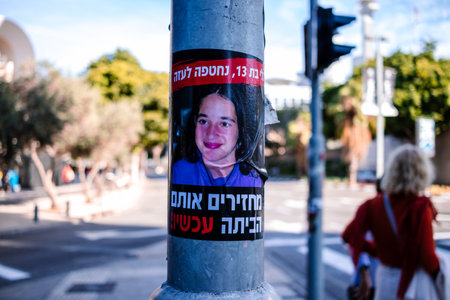 Tel Aviv, Israel - December 16, 2023 Posters of the face of the hostages kidnapped by Hamas during the terrorist attack of October 7, 2023 are displayed in the streets of Tel Aviv.のeditorial素材