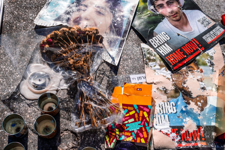 Tel Aviv, Israel - December 15, 2023. Dizengoff Square Memorial, Gifts and posters of the faces of hostages kidnapped by Hamas during the October 7, 2023 terrorist attack are on display.のeditorial素材