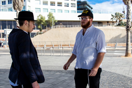 Tel Aviv, Israel - December 13, 2023 Orthodox Israelis offer to pray on the streets of Tel Aviv,...