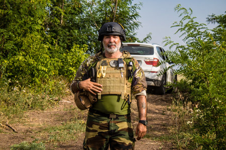Donbass, Ukraine, July 06, 2024 Journalists at the frontline in the gray zone between Ukrainian and Russian armed forces. This buffer zone is dangerous and fighting rages in the region.のeditorial素材