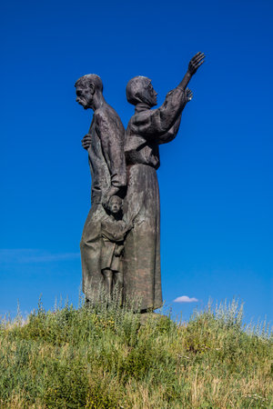 Kharkiv, Ukraine, June 25 2024 Holodomor Monument depicts a peasant family, a man, a woman and two children symbolizing suffering and hope. Since the start of the war the monument has been abandoned.のeditorial素材