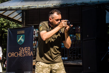 Lviv, Ukraine, August 18, 2024 Ukrainian military music group Siver Orchestra performing in a fundraiser for the Ukrainian army at the city of Lviv in Ukraine.の写真素材