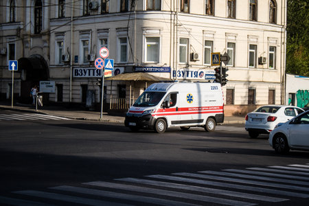 Kharkiv, Ukraine, September 12, 2024 Ambulance rolling downtown Kharkiv during the war with Russia, Kharkiv is the target of Russian missiles and sirens sound every dayの写真素材