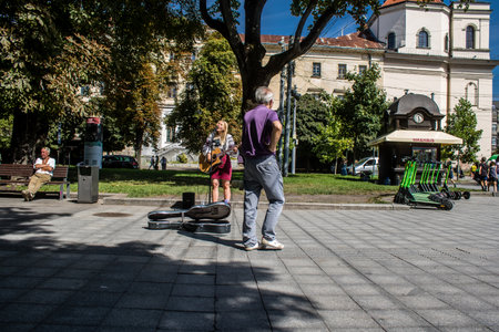 Lviv, Ukraine, August 24, 2024 People walk in the city center of Lviv on the Independence Day. During the war with Russia, the city of Lviv are threatened and targeted by Russian missiles.のeditorial素材