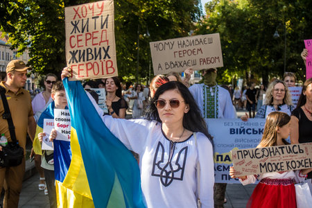 Lviv, Ukraine, August 24, 2024 Public protest against the compulsory conscription of young Ukrainians who are sent to wage war against Russia. People support the law about terms of service.のeditorial素材