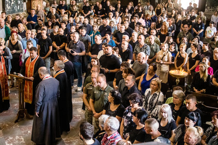 Lviv, Ukraine, August 23, 2024 People attend the funeral of three Ukrainian soldiers who died in a battle against the Russian army at the Church of the Most Holy Apostles Peter and Paul in Lviv.のeditorial素材