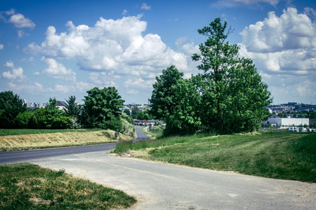 Reims, France, May 14, 2025. Landscape near the city of Reims in France. In spring, the cereal fields in the Champagne plain begin to grow and cover the horizon with an intense green.の写真素材