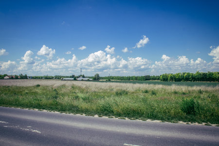 Reims, France, May 14, 2025. Champagne landscape near the city of Reims in France. In spring, the cereal fields in the Champagne plain begin to grow and cover the horizon with an intense green.の写真素材