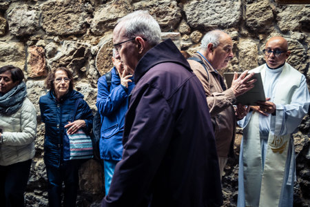 Jerusalem, Israel, 19 February 2026  Italian Christian pilgrims led by a priest conduct an official...