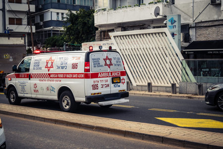 Tel Aviv, Israel, January 19, 2026 Magen David Adom (MDA) ambulance driving with emergency lights through the streets of Tel Aviv, Israel. Urban emergency services scene.のeditorial素材