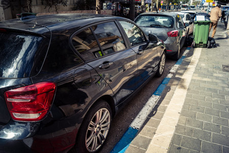 Tel Aviv, Israel, February 25 2026, row of parked cars on the side of a street, an archive of urban...